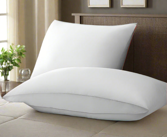 TY Glamour Collection Pillows from T-Y Group, featuring plush white hotel-quality bedding for luxurious comfort and support.